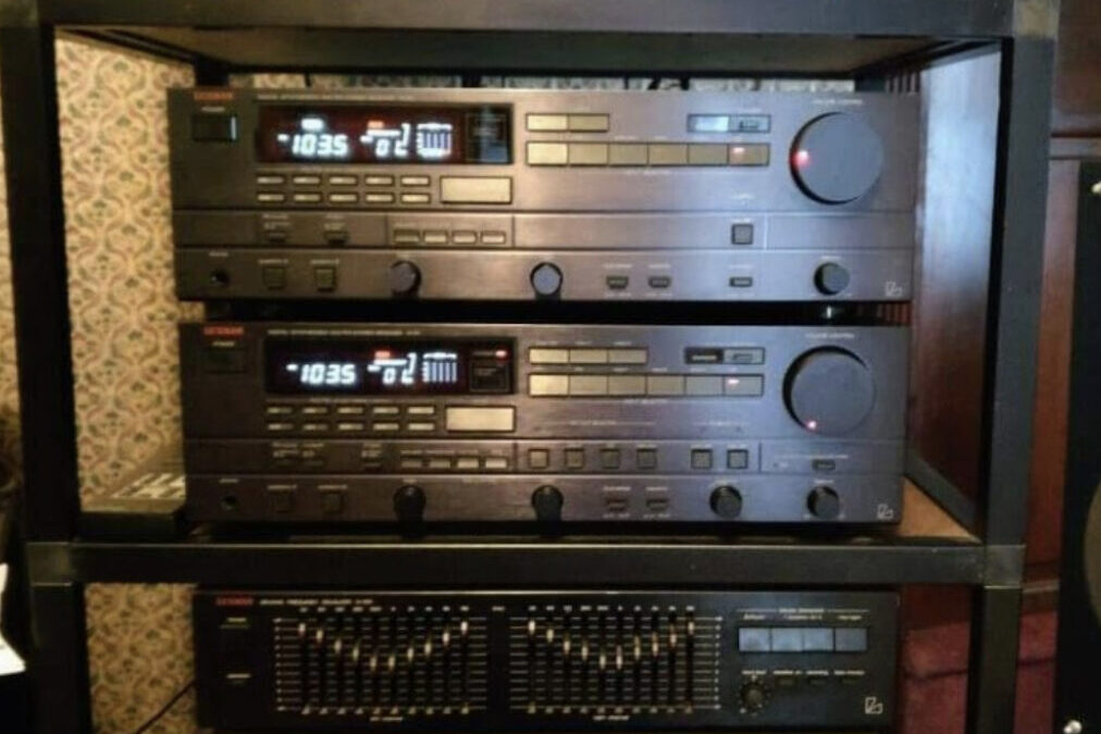 Stereo system rack built using EZTube, the global supplier of commercial and industrial framing, to store power amp, equalizer, CD player, cassette deck, integrated amp, and turntable