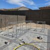 Outdoor kitchen frame, barbecue pit, living area, outdoor BBQ pit, and building under construction using square tubes, metal tube, square tube connectors, 8020 tubes, t slot extrusions, linear rail tubes, 80 t slot connectors 20, 2020 eztubes, press fit connectors, ez tubes, faux stone panel, stone, concrete, stone wall, and metal framing