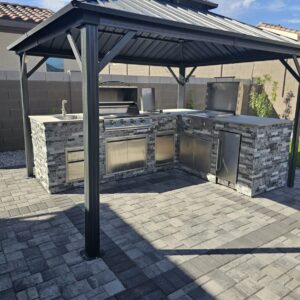 BBQ Grill Island, outdoor kitchen frame, BBQ island, barbecue pit, living area, outdoor BBQ pit, and building under construction using square tubes, metal tube, square tube connectors, 8020 tubes, t slot extrusions, linear rail tubes, 80 t slot connectors 20, 2020 eztubes, press fit connectors, ez tubes, faux stone panel, stone, concrete, stone wall, and metal framing