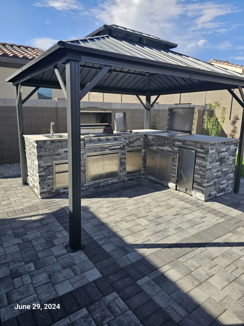 BBQ Grill Island, outdoor kitchen frame, BBQ island, barbecue pit, living area, outdoor BBQ pit, and building under construction using square tubes, metal tube, square tube connectors, 8020 tubes, t slot extrusions, linear rail tubes, 80 t slot connectors 20, 2020 eztubes, press fit connectors, ez tubes, faux stone panel, stone, concrete, stone wall, and metal framing